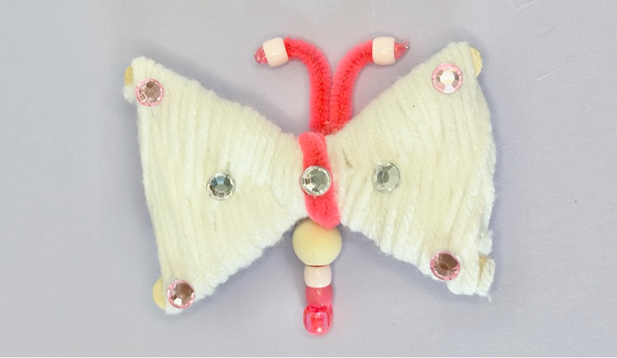 Real yarn butterfly craft with colorful beads