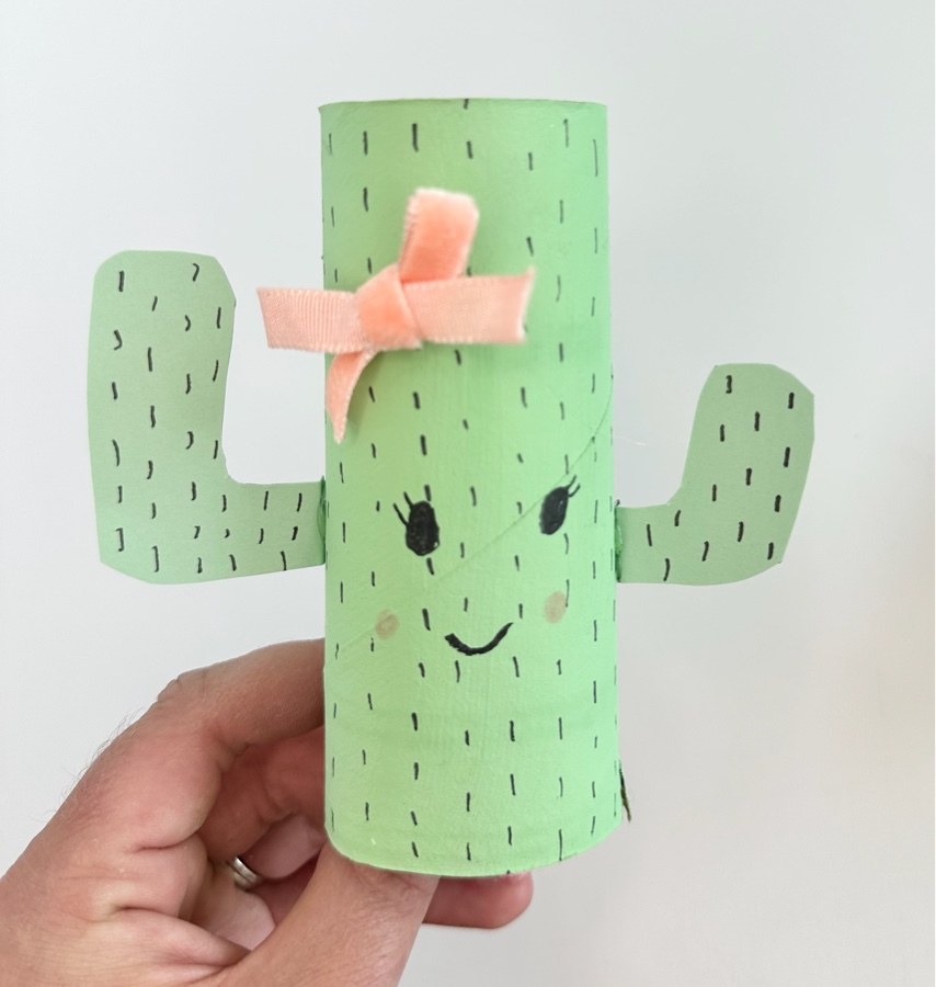 Handmade green paper-roll cactus with a pink bow